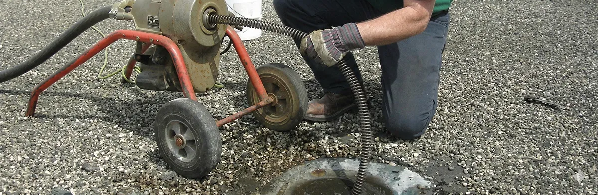 sewer rodding technician actively removing blockages from a sewer line in Fort Collins, CO